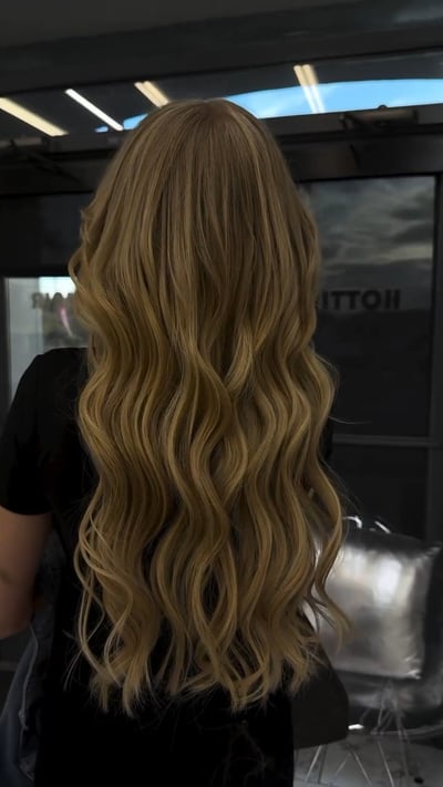 after photo of seamless extensions: 2 rows hand-tied + 25 individuals transformation hair transformation by Dafne Lopez at Hottie Hair salon Las Vegas - extensions service