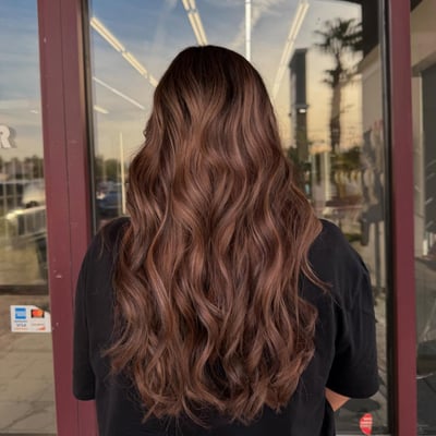 after photo of rich brunette transformation with soft waves hair transformation by Dafne Lopez at Hottie Hair salon Las Vegas - color service