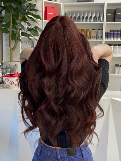 after photo of 2-row hand-tied sew-in extension installation with red hair hair transformation by Shirley Gonzalez at Hottie Hair salon Las Vegas - extensions service