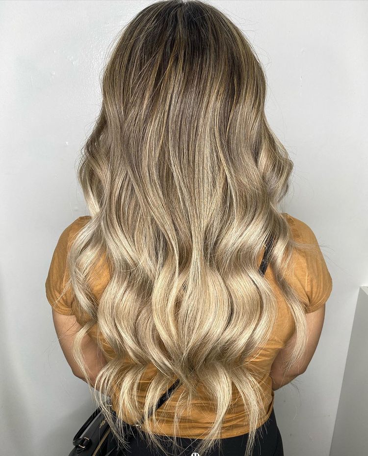 22 Inch Blonde Balayage I-Tip Hair Extensions Installed On Women