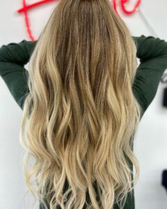 Get Ready to Turn Heads with a Blonde Balayage and 22" Russian Virgin Tape in Extensions